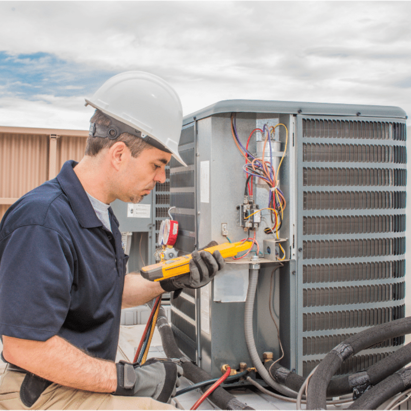 Strathroy Heating & Cooling HVAC technician servicing a system