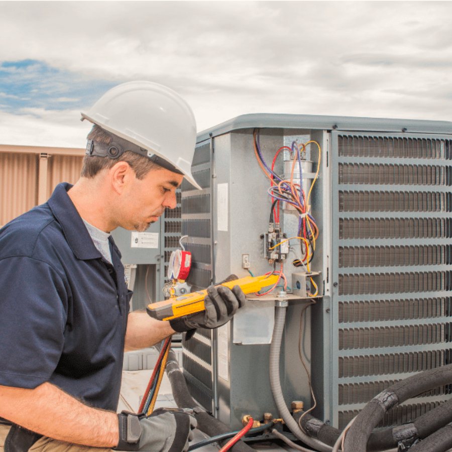 Strathroy Heating & Cooling HVAC technician servicing a system