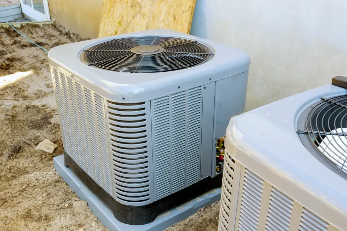 Two outdoor air conditioner condensers